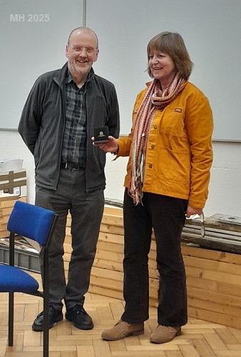 Chris Leach presents medal to Mary Howrad